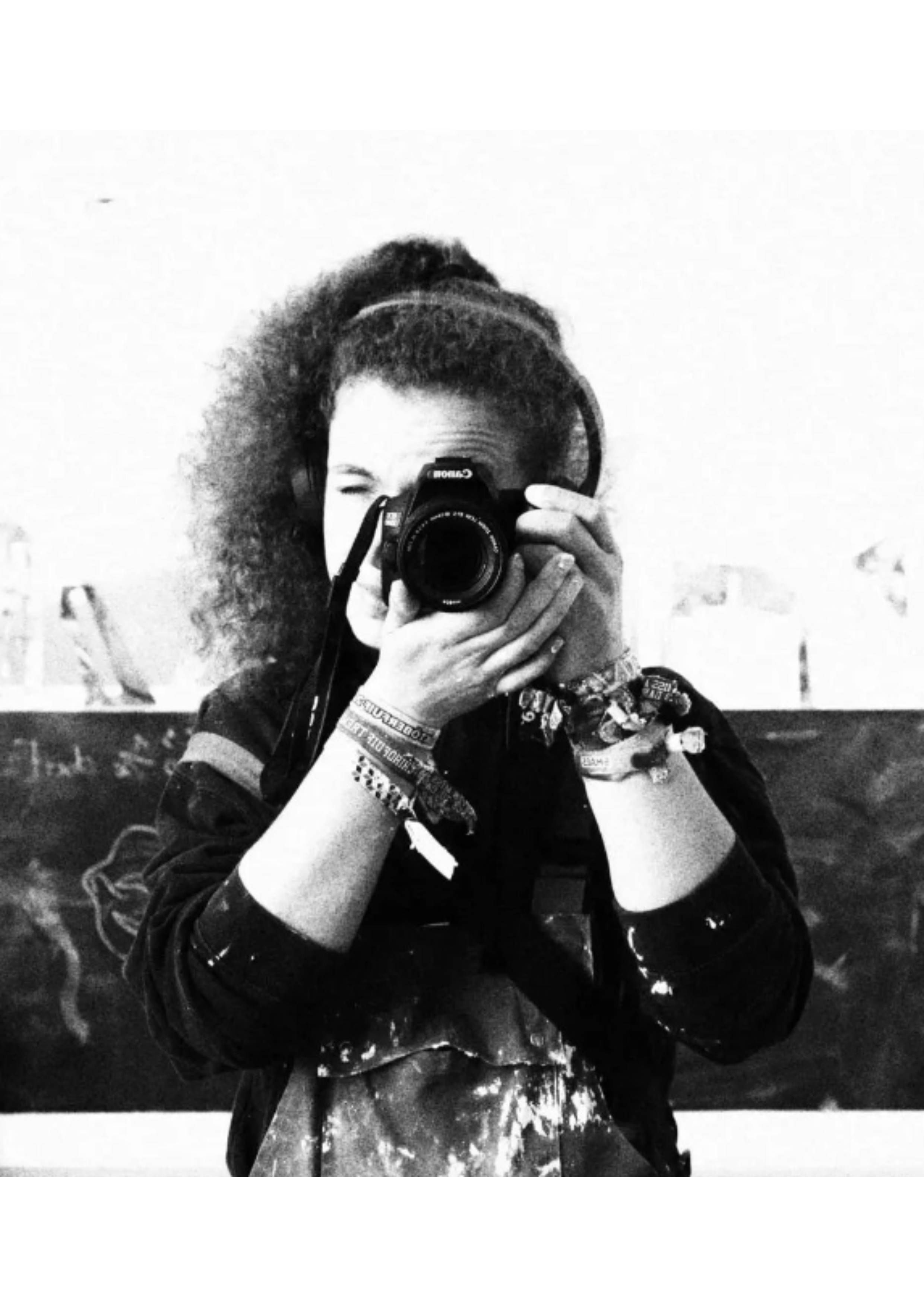 picture of artist holding camera