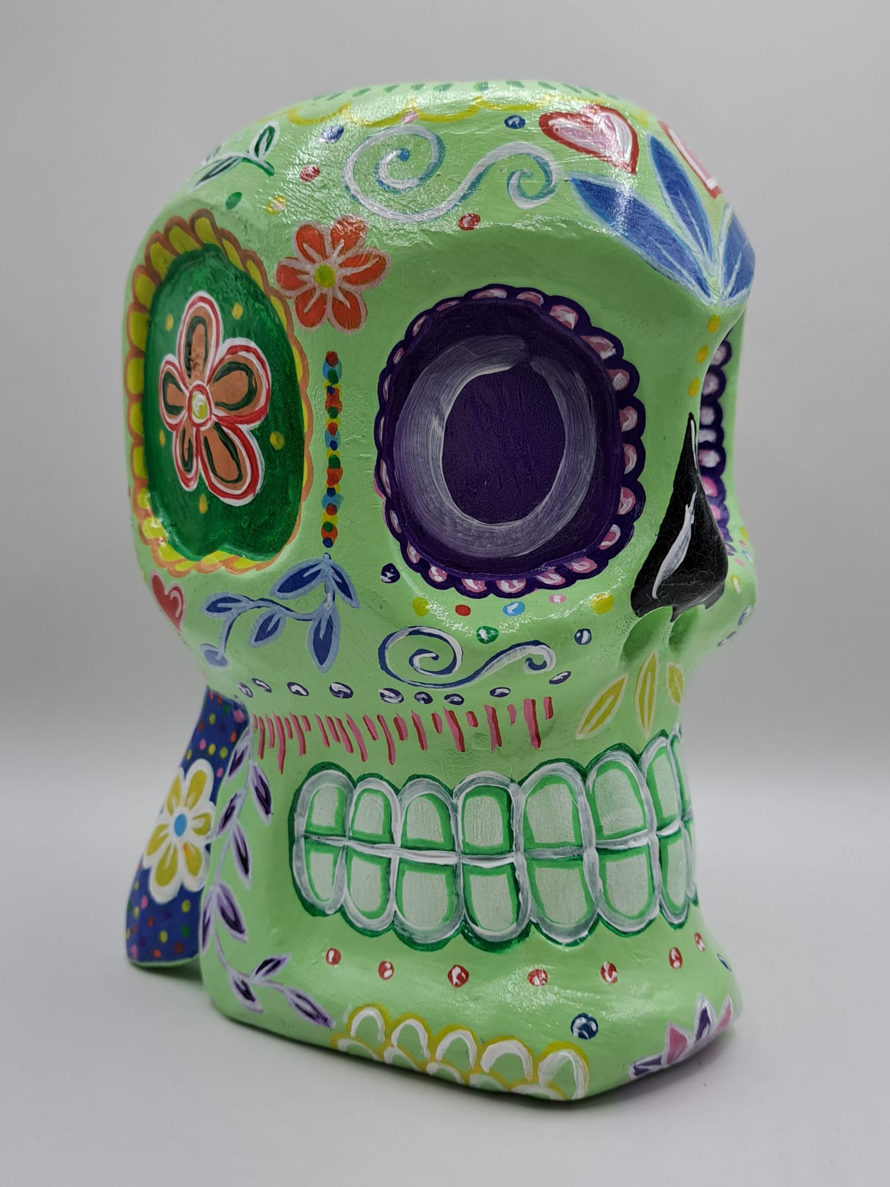 green skull statue