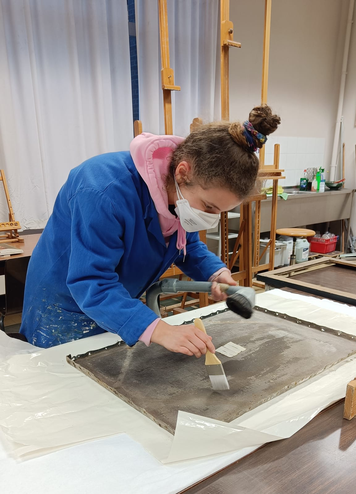 picture of artist restoring